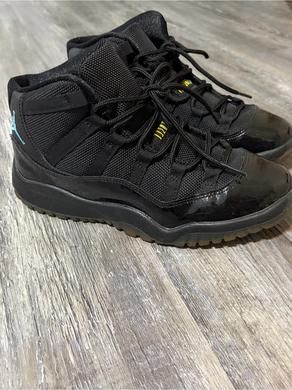 Jordan Black High-Top Sneakers with Teal Jumpman